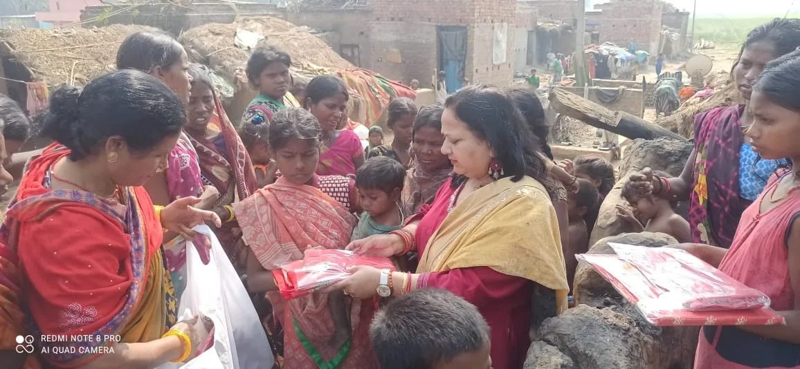BMKK team distributing relief and support material in a village